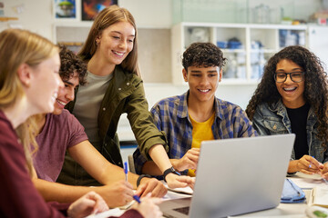 Fototapeta na wymiar Happy smiling teens students studying in group