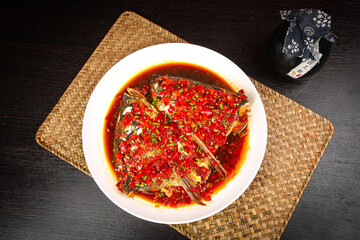 Steamed Fish Head with Chopped Chilies Chinese Cuisine Spicy Dish on Bamboo Placemat