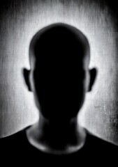 Close-up of a shadowy, faceless person
