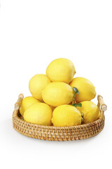 Fresh Yellow Lemons in Wicker Basket on White Background
