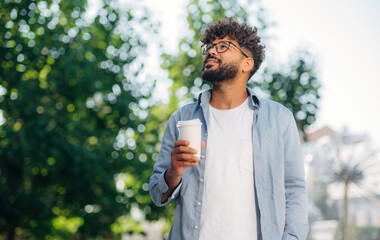 Handsome man is outdoors in the city