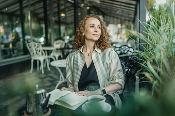 Businesswoman enjoying coffee in a cafe setting