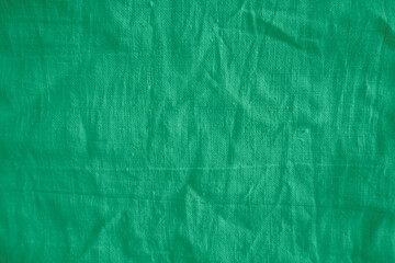 Teal silk fabric drapes, studio shot, elegant waves, background blur, textile design