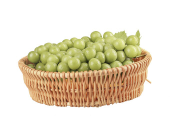 Fresh Green Grapes in Wicker Basket Isolated on White Background