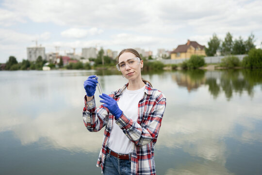 Young female biologist conducting field research