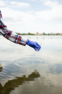 Biologist Collecting Water Samples from a Lake