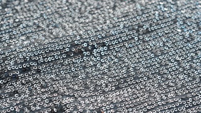 sequins on silver tulle fabric.
Carnival costume with shiny sequins on fabric.
Festive outfit for parties.
Shiny fabric with sequins macro video