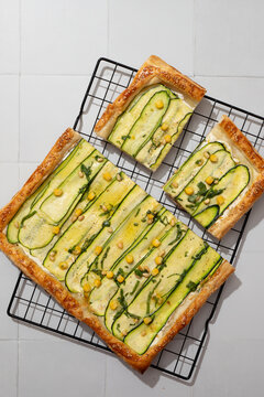 Top view of courgette tart with corn and ricotta