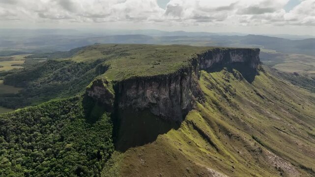 Aerial view of the majestic Chiricayen Tepui, with its dramatic cliffs and green vegetation contrasting against the rocky terrain, Chiricayen Tepui, Santa Elena de Uairen, Venezuela.