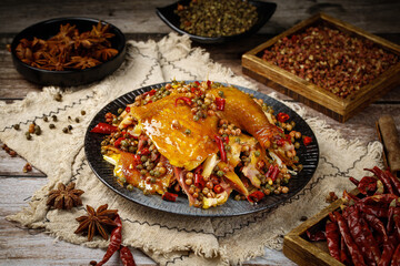 Spicy Chicken with Red Peppers and Traditional Spices - Mouthwatering Asian Cuisine on Rustic Wood Background