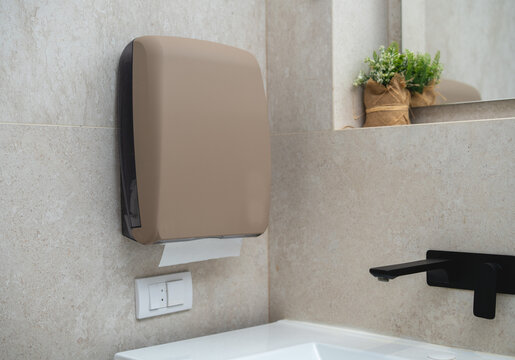 Sandy texture paper towel dispenser in modern bathroom