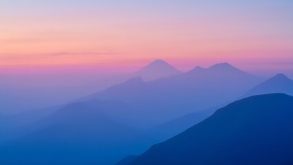 Obraz premium Misty Mountain Peaks at Sunrise: Soft Pastel Sky