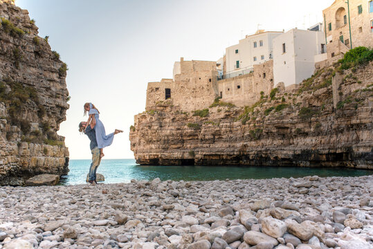 Couple enjoying seaside view in Polignano a Mare