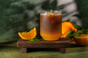 Bumble coffee with orange slice on rustic table