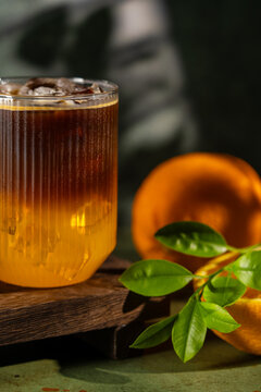 Refreshing bumble coffee with orange and ice served
