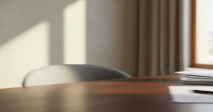 Modern workspace with light shadows and empty chair