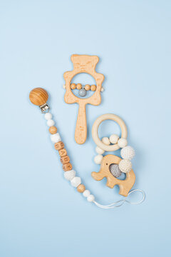 Eco-friendly baby wooden toys on pastel background