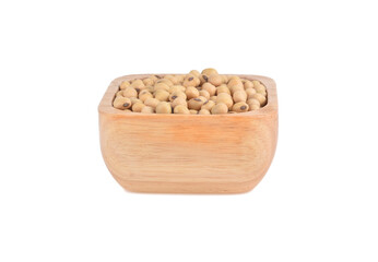 Soy beans seed in wooden bowl isolated on white background.