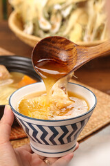 Honey Lemon Flower Soup Zhaoqing Style - Traditional Chinese Nutritious Broth with Dried Ingredients Served in Decorative Bowl