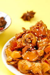 Spicy Glazed Squid Rings with Sesame Seeds Asian Seafood Appetizer on Yellow Background