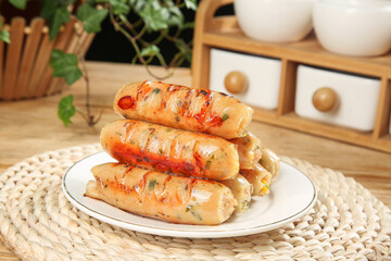 Grilled Sausages with Crispy Golden Skin Stacked on White Plate in Rustic Kitchen