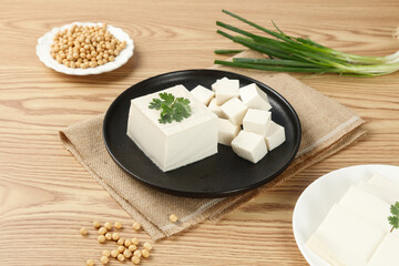 Fresh Handcooked Tofu Blocks and Cubes with Soybeans on Wooden Base - Traditional Asian Protein Food