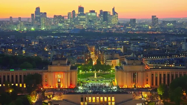 The center of Paris, Trocadero Square from the height of the Eiffel Tower. People walk and take pictures against the backdrop of the tower