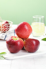 Fresh Red Apples with Dew Drops from Yunnan Plateau China Morning Light Kitchen Scene