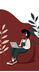 African American woman working remotely on laptop from a comfortable bean bag chair, wearing headphones. Ideal for home office, online learning, and casual productivity concepts.
