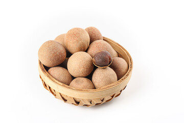 Fresh Longan Tropical Fruits in Bamboo Basket on White Background