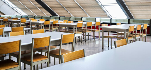 Wooden chairs in rows in interior architecture