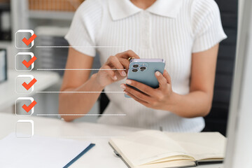 Fototapeta premium Business performance checklist concept, woman using tablet and laptop doing online checklist survey, filling out digital form checklist.