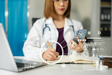 Fototapeta premium Doctor working on laptop and tablet and medical on clipboard on desk, electronics medical record system EMRs concept.
