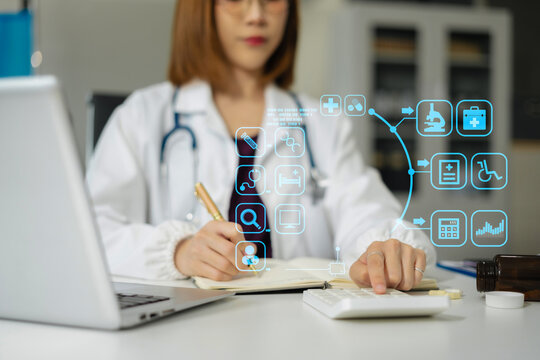 Doctor physician with stethoscope calculate medical fee costs or revenue. practitioner use calculator at Clinic.