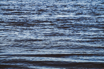 Dark blue ripples on the river surface