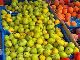 Pears displayed in crate at open market. Agriculture, nutrition, and seasonal fruit harvest representing crop abundance, rural supply, and healthy organic lifestyle.