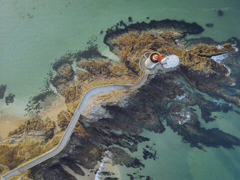 Aerial view of the Pointe du Minou Lighthouse standing proudly against the crashing waves of the Atlantic ocean, Plouzan&Atilde;&copy;, Finistre, France.