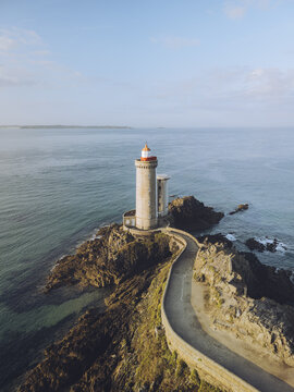 Aerial view of the Minou lighthouse standing tall on the rocky Pointe du Minou peninsula, a beacon against the vast expanse of the sea, Plouzan&Atilde;&copy;, Finist&Atilde;&uml;re, France.