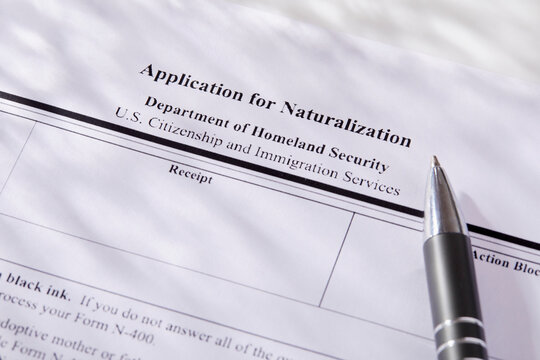Close-up of pen on application for citizenship