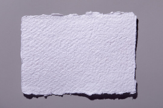 Torn paper on gray background