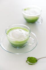 Homemade ceremonial matcha latte with frothy milk