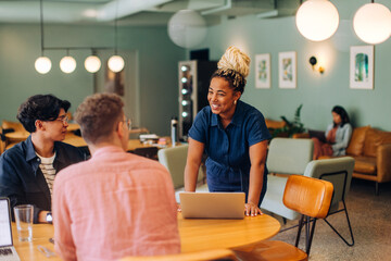 Group conversation with diverse professionals in a casual office setting