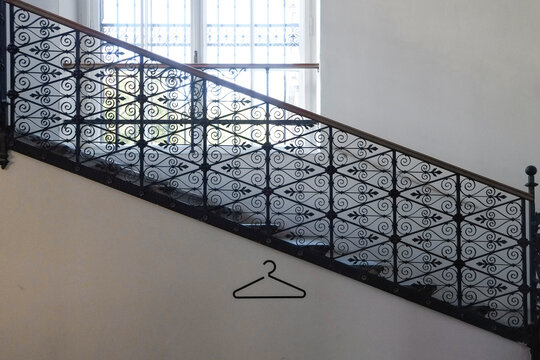 Staircase with ornate metal balustrade