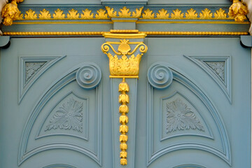 Close-up of old blue and gold carved door