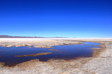 the landscape of Salar de Uyuni salt flat in Bolivia