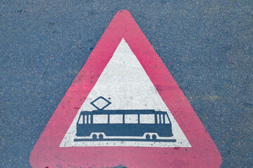 Tram warning sign on street