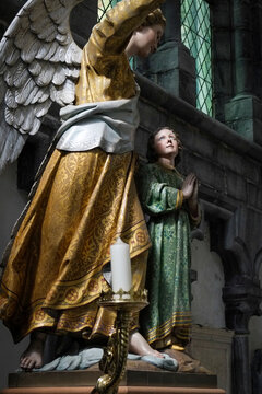 Angel and saint statues inside Church of Our Lady