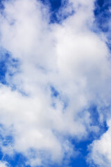 Obraz premium The sky is blue and adorned with fluffy white clouds floating in it