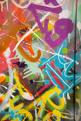 Vibrant graffiti art filled with colorful splashes and abstract designs.