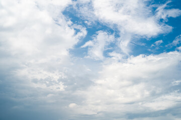 Dramatic sky with fluffy white clouds and deep blue contrasts.